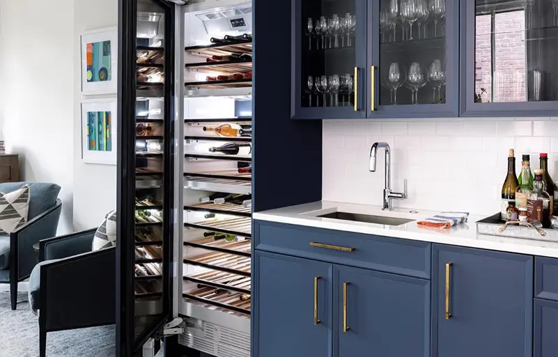 Kitchen with deep blue cabinets and a crisp white countertop, showcasing a clean, modern contrast and elegant coastal-inspired design.