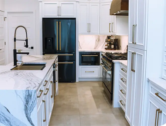 Bradenton kitchen with crisp white cabinetry and elegant Cambria quartz countertops, blending timeless style with modern functionality.