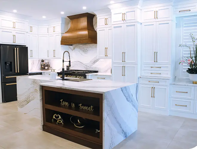 Bradenton kitchen with white cabinets and countertops, highlighted by chrome metallic accents above the cooking area for a sleek, modern look.