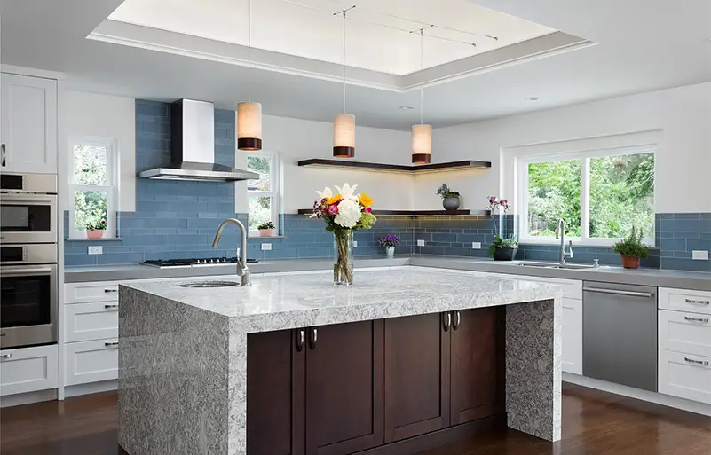 Edited image of Saratoga Titus Ave kitchen featuring modern cabinetry, sleek surfaces, and a bright, open layout.