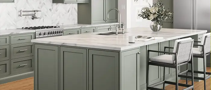 Close-up of kitchen detail with grey furniture and white countertop, blending modern tones with clean design.