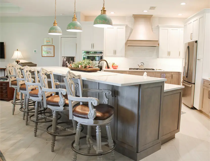 Kitchen featuring a soft white and beige palette with light cabinetry, warm countertops, and a serene modern layout.
