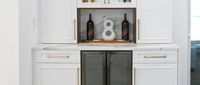 Close-up of renovated kitchen detail featuring updated cabinetry, sleek hardware, and contemporary surface finishes.