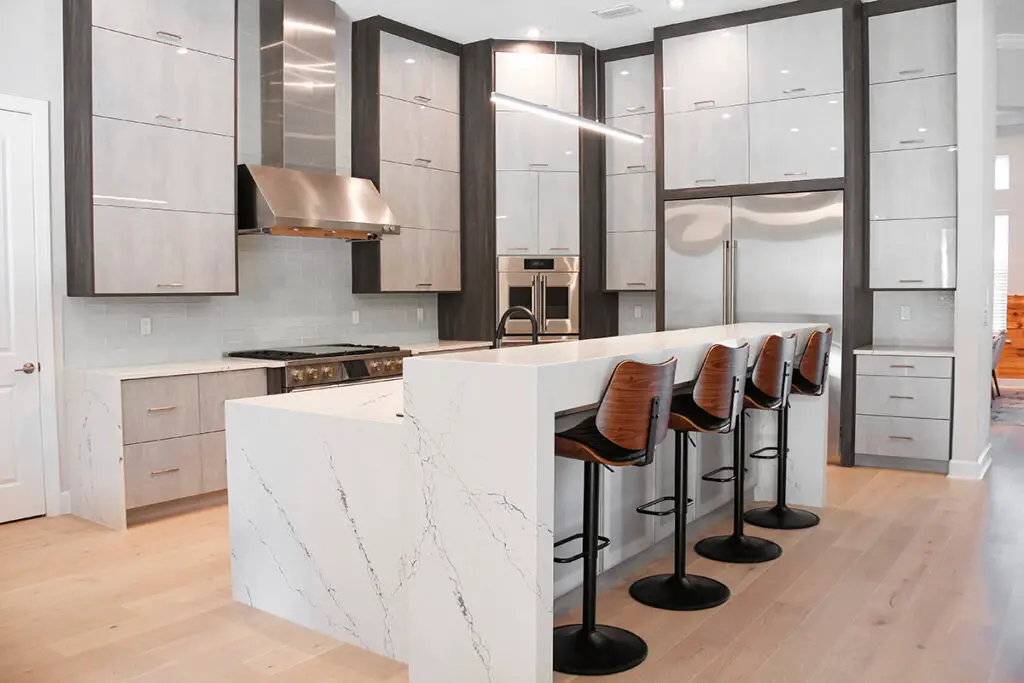 Functional and elegant loft kitchen rendered in 3D with sunlight pouring through tall windows. White gloss kitchen doors in a Sarasota 3d rendering interior design