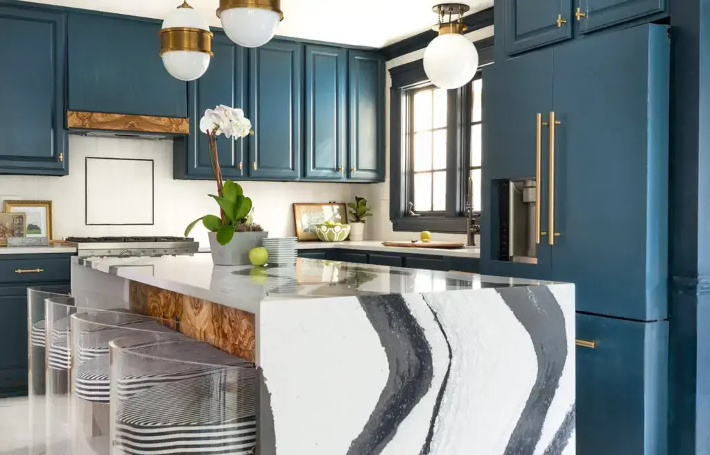 Modern kitchen remodel with dark blue cabinets and white quartz countertops, designed by Kirkplan Kitchens — part of their local portfolio for 'kitchen remodel near me' projects.