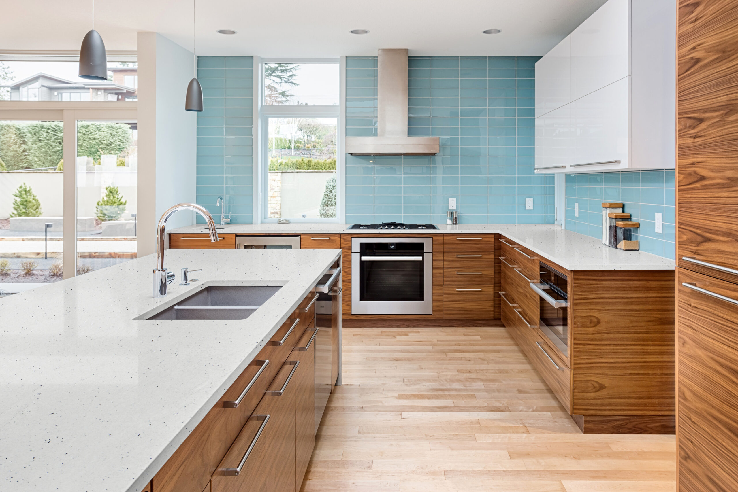 Modern and functional kitchen remodel in Sarasota, FL, showcasing 2025 kitchen design trends including minimalist cabinetry, smart appliances, and natural wood finishes.
