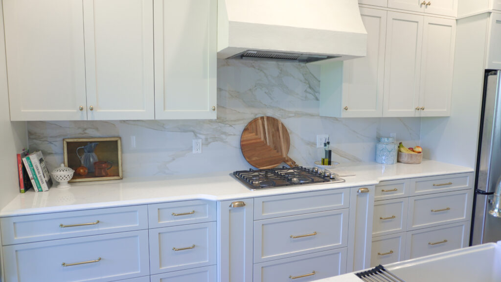 Kitchen with white cabinetry and golden appliances remodeled by Kirkplan Kitchen - our Bradenton, FL project